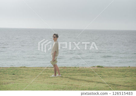A man in his 30s working remotely at a resort A man in his 30s working remotely at a resort 126515483