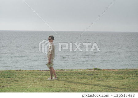 A man in his 30s working remotely at a resort A man in his 30s working remotely at a resort 126515488