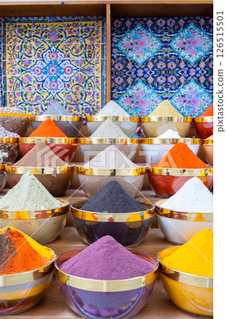 Traditional spices market. Pots and wooden tubs stand in row with colorful tea, spices, fruits, roots, flowers. Street bazaar. Dubai, UAE. Vertical photo Traditional spices market. Pots and wooden tubs stand in row with colorful tea, spices, fruits, roots, flowers. Street bazaar. Dubai, UAE. Vertical photo 126515501