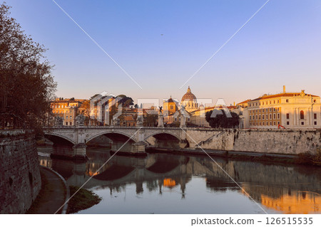 Rome in morning. Panoramic view of Castel Sant'Angelo and Bridge in Rome with reflection in Tiber river. Rome in morning. Panoramic view of Castel Sant'Angelo and Bridge in Rome with reflection in Tiber river. 126515535