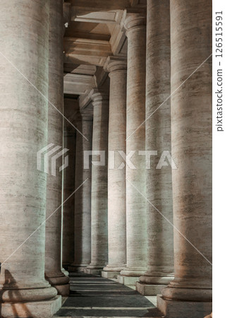 Columns in row close-up. St Peter's Basilica against night sky in Vatican City, Rome, Italy. Vertical photo 126515591