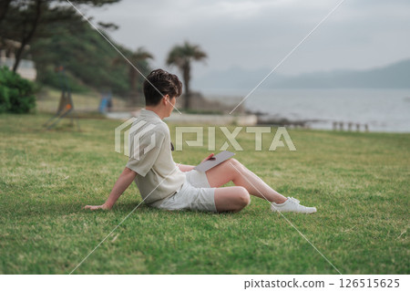 A man working remotely at a resort A man working remotely at a resort 126515625