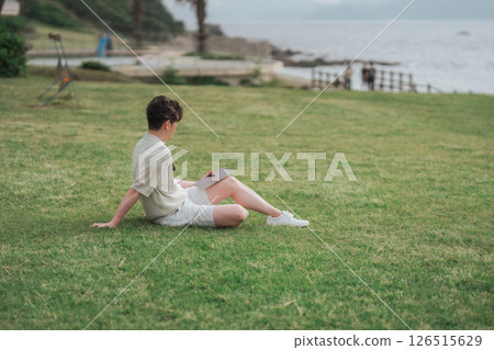 A man working remotely at a resort A man working remotely at a resort 126515629