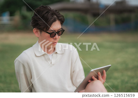 A man working remotely at a resort A man working remotely at a resort 126515659