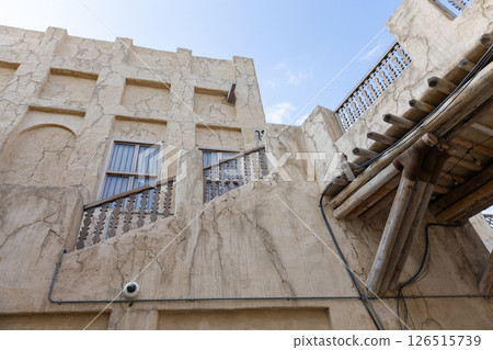 Old town in Al Seef Cultural Historical District on shores of Dubai Creek. Tourist place with old streets, houses and shops, Dubai, UAE Old town in Al Seef Cultural Historical District on shores of Dubai Creek. Tourist place with old streets, houses and shops, Dubai, UAE 126515739