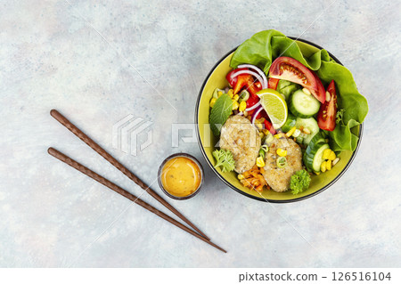 Lunch bowl of fish cutlets. 126516104