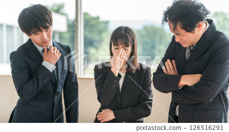 Businessman and businesswoman worried and thinking during a meeting Businessman and businesswoman worried and thinking during a meeting 126516291