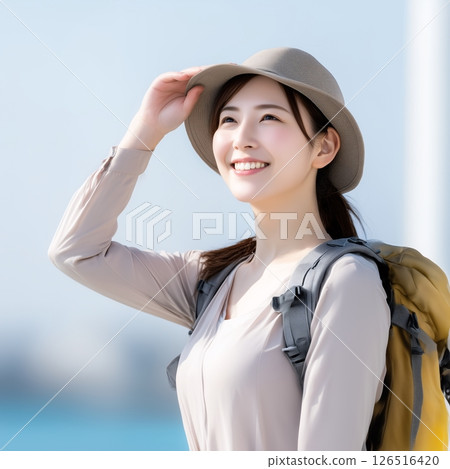 Smiling young woman very satisfied with her summer trip 126516420