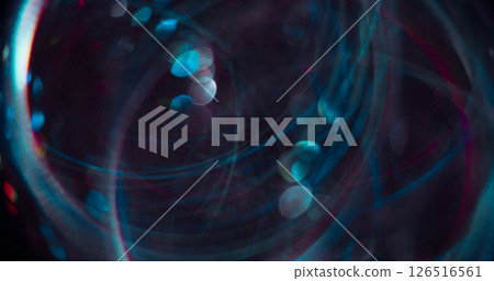 Lens flare. Blur night glow. Multicolored blue round radiance on dark black bokeh light art abstract background. Lens flare. Blur night glow. Multicolored blue round radiance on dark black bokeh light art abstract background. 126516561