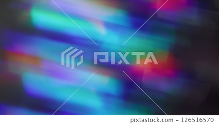Blurred light flashes. Crystal flare lens. Multicolor blue pink purple glow motion on dark black background with bokeh effect. 126516570