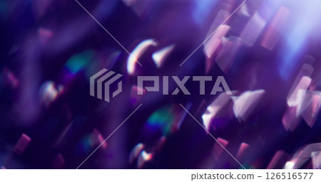 Defocused beam glare. Flare particles. Bright white gleam twirling lens on blue purple smooth defocused bokeh light background. 126516577