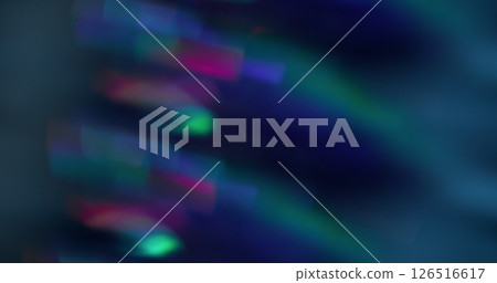 Blurred light flash. Crystal flare lens. Multicolor blue pink green kaleidoscope background with bokeh effect. Blurred light flash. Crystal flare lens. Multicolor blue pink green kaleidoscope background with bokeh effect. 126516617