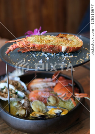 two-tiered luxury platter of lobster and seafood crabs shrimp langoustines shellfish delicious luxury food 126516677