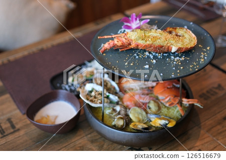 two-tiered luxury platter of lobster and seafood crabs shrimp langoustines shellfish delicious luxury food 126516679