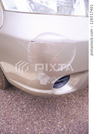 Bumper of a car hit and run by a white car 126517401