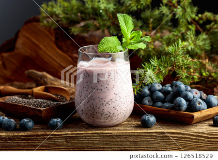 Blueberry smoothie with chia seeds and fresh berries. 126518529