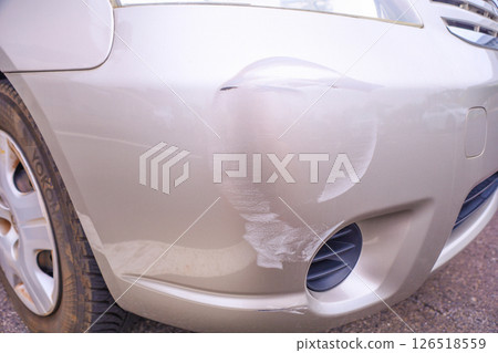 Bumper of a car hit and run by a white car Bumper of a car hit and run by a white car 126518559