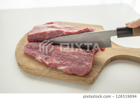 Cut beef into chunks Cut beef into chunks 126519094