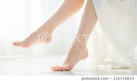 Image of a white-skinned woman raising her healthy, beautiful legs, beautiful heels, ankles Image of a white-skinned woman raising her healthy, beautiful legs, beautiful heels, ankles 126519819