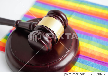 Gavel for judge lawyer on rainbow flag, symbol of LGBT pride month. 126520657
