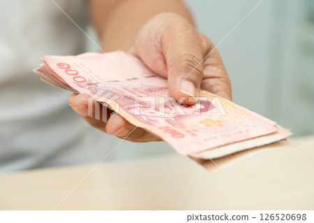Asian woman counting Thai baht banknote money, investment economy, accounting business and banking. 126520698