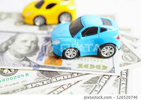 Bangkok, Thailand November 18, 2023 Car on banknote money, buying or insurance concept. 126520746