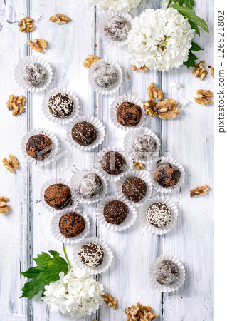raw vegan balls Truffles with Walnuts and Flowers 126521802