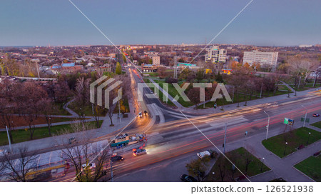 Road intersection with reconstructed tram tracks aerial panoramic day to night timelapse. Road intersection with reconstructed tram tracks aerial panoramic day to night timelapse. 126521938