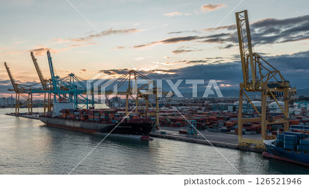 Aerial view of the sea cargo port and container terminal of Barcelona timelapse, Barcelona, Catalonia, Spain. Aerial view of the sea cargo port and container terminal of Barcelona timelapse, Barcelona, Catalonia, Spain. 126521946