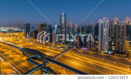 Dubai Marina skyscrapers aerial top view before sunrise from JLT in Dubai night to day timelapse, UAE. 126521973