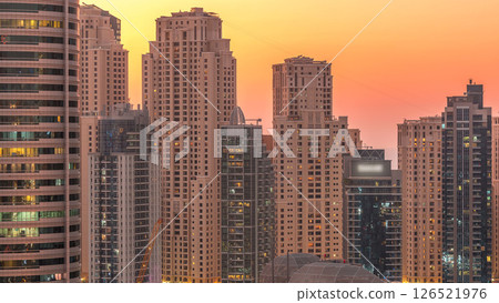 Dubai marina and JBR towers panorama day to night timelapse lights turn on. 126521976