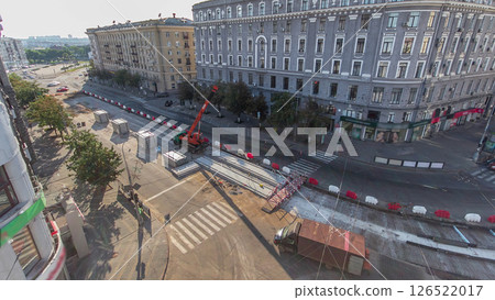 Installing concrete plates by crane at road construction site timelapse. 126522017