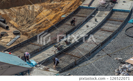 Workers with protective mask welding reinforcement for tram tracks in the city timelapse 126522071