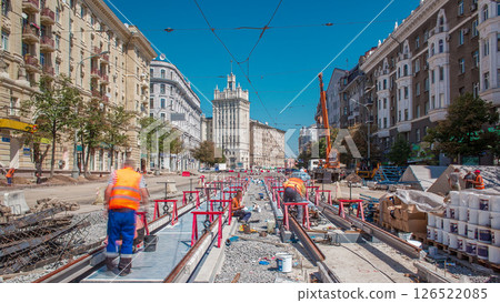 Tram rails at the stage of their installation and integration into concrete plates on the road timelapse Tram rails at the stage of their installation and integration into concrete plates on the road timelapse 126522085