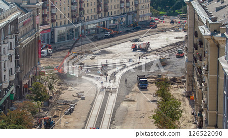 Concrete works for road construction with many workers and mixer timelapse 126522090
