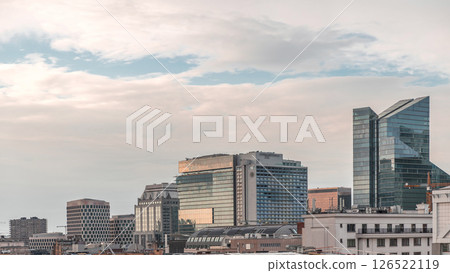 Aerial timelapse of modern skyscrapers and towers in Brussels with glass facades reflecting cloudy sky. Belgium 126522119