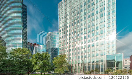 Timelapse panorama of modern office buildings. Glass skyscrapers with reflections and highlights 126522136