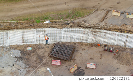 Aerial view of workers with protective mask welding reinforcement for tram tracks in the city timelapse 126522181