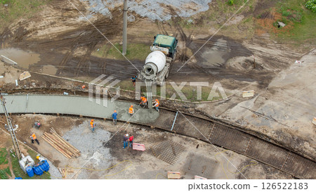 Concrete works for road construction with many workers and mixer timelapse Concrete works for road construction with many workers and mixer timelapse 126522183