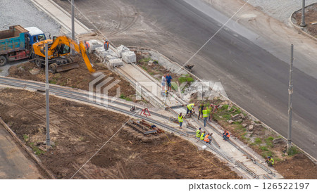 Industrial truck loader excavator moving ground and loading into a dumper truck timelapse 126522197