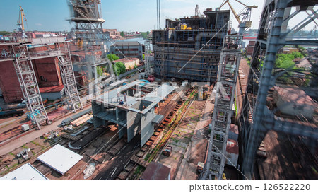 The construction of a large ship on a shipyard with cranes timelapse. The construction of a large ship on a shipyard with cranes timelapse. 126522220
