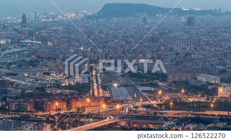Barcelona and Badalona skyline with roofs of houses and sea on the horizon day to night timelapse Barcelona and Badalona skyline with roofs of houses and sea on the horizon day to night timelapse 126522270