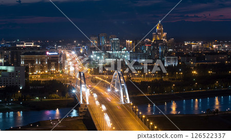 Evening timelapse above the Bridge with the transport and clouds on the background. Central Asia, Kazakhstan, Astana Evening timelapse above the Bridge with the transport and clouds on the background. Central Asia, Kazakhstan, Astana 126522337