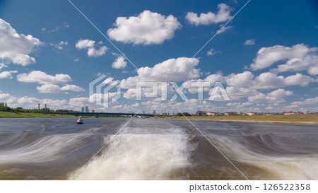 Astana, Kazakhstan. View from Pleasure boat on the river Ishim timelapse hyperlapse drivelapse in Astana. Astana, Kazakhstan. View from Pleasure boat on the river Ishim timelapse hyperlapse drivelapse in Astana. 126522358
