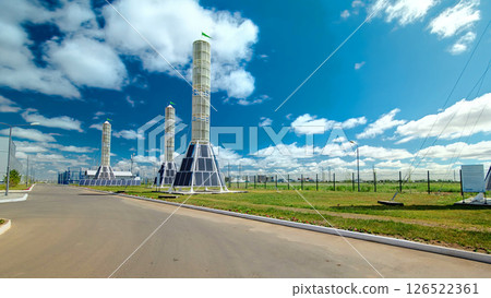 Solar Panel towers on solar plant with High Voltage Tower in Background timelapse hyperlapse 126522361