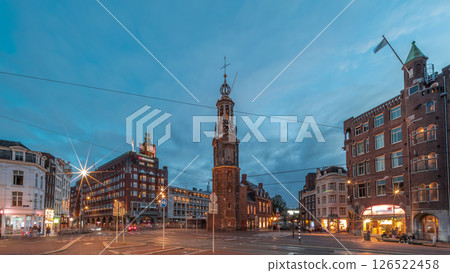 Munttoren tower and flowers market. Panoramic day to night timelapse hyperlapse of Amsterdam city center. Netherlands 126522458
