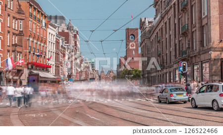 Electric tram on Damrak Street heading from Dam Square to Centraal Station in a timelapse. Amsterdam, Netherlands 126522466