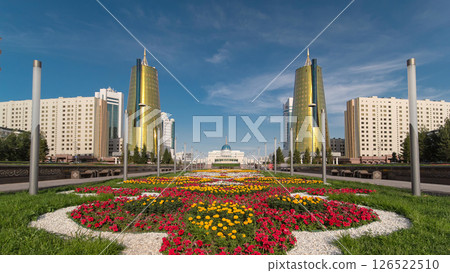 A square in front of Ak Orda with Altyn Orda business center timelapse hyperlapse in the foreground. 126522510