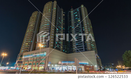 Modern new towers in Ajman night timelapse hyperlapse. Cityscape of Ajman. 126522533