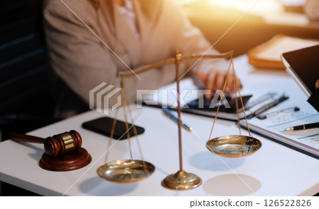 Consultation and conference of lawyers and professional businessman working and discussion having at law firm in office. Concepts of law, Judge gavel with scales of justice. Consultation and conference of lawyers and professional businessman working and discussion having at law firm in office. Concepts of law, Judge gavel with scales of justice. 126522826